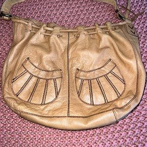 Lucky Tan Purse. Used but in very good shape. No low ballers please.